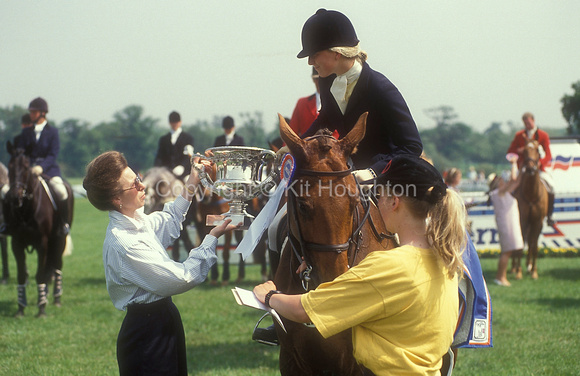 Daisy Dick (GBR) riding Little Victor is presented with a cup by Princess Anne EV278-06-02