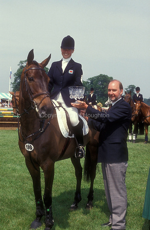 Lucy Jennings riding Diamond Pedler is presented with a trophy by John Cronin EV279-04-24