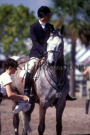 Mounted rider with groom cleaning boots SJ154-06-10