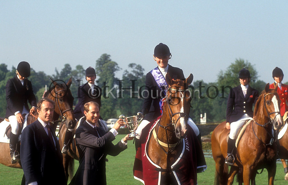 Tina Cassan on Genesis receive the Queen Elizabeth cup from Prince EdwardRoyal International Horse Show SJ130-02-13.JPG