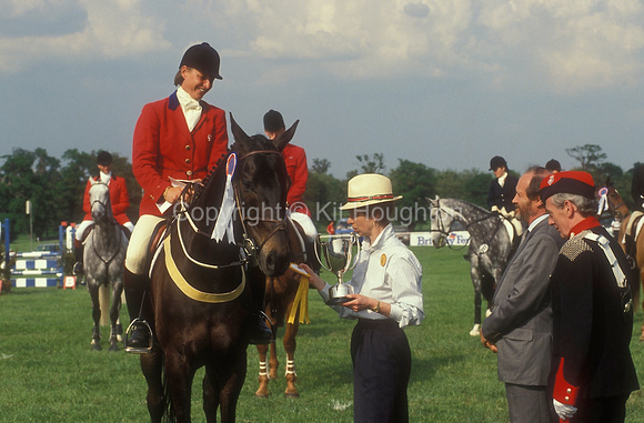 Marie-Christine Duroy (FRA) riding Rebaby is presented with a trophy by Princess Royal EV278-01-19