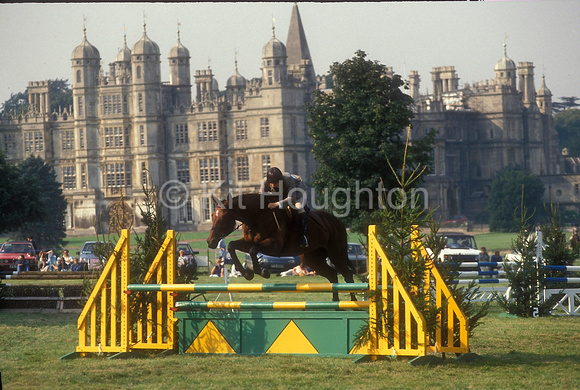 Burghley House with pony club showjumper in foreground EV203-08-20