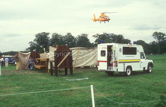 Air ambulance takes injured rider to hospital. Screens are hiding a fallen horse following an accident at a table fence EV305-08-22