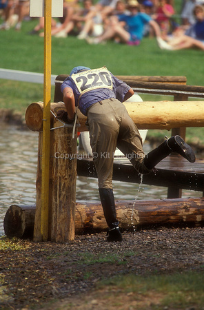 Natasha Wheeler emptying out water from top boots EV278-04-24